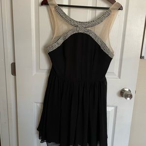Cocktail dress . Black dress with mesh and beading detail